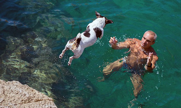 cliff diving dog and owner